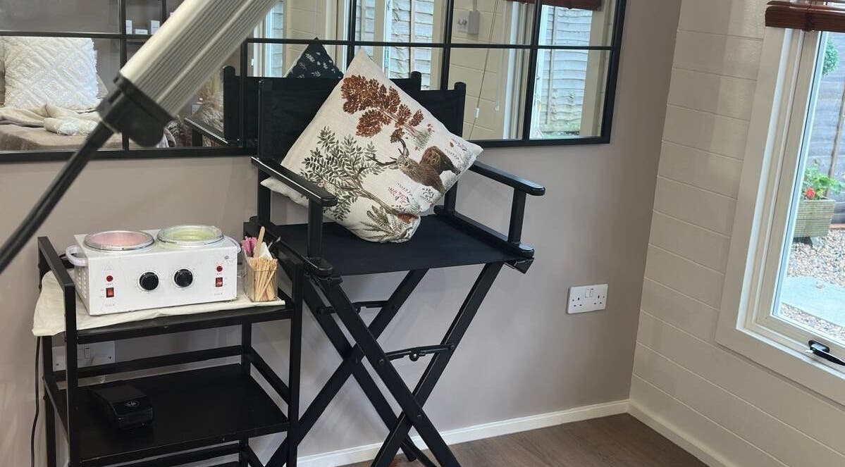 Beauty treatment chair and wax setup at The Skin Chalet, Headley, England, GB, offering tranquil luxury.