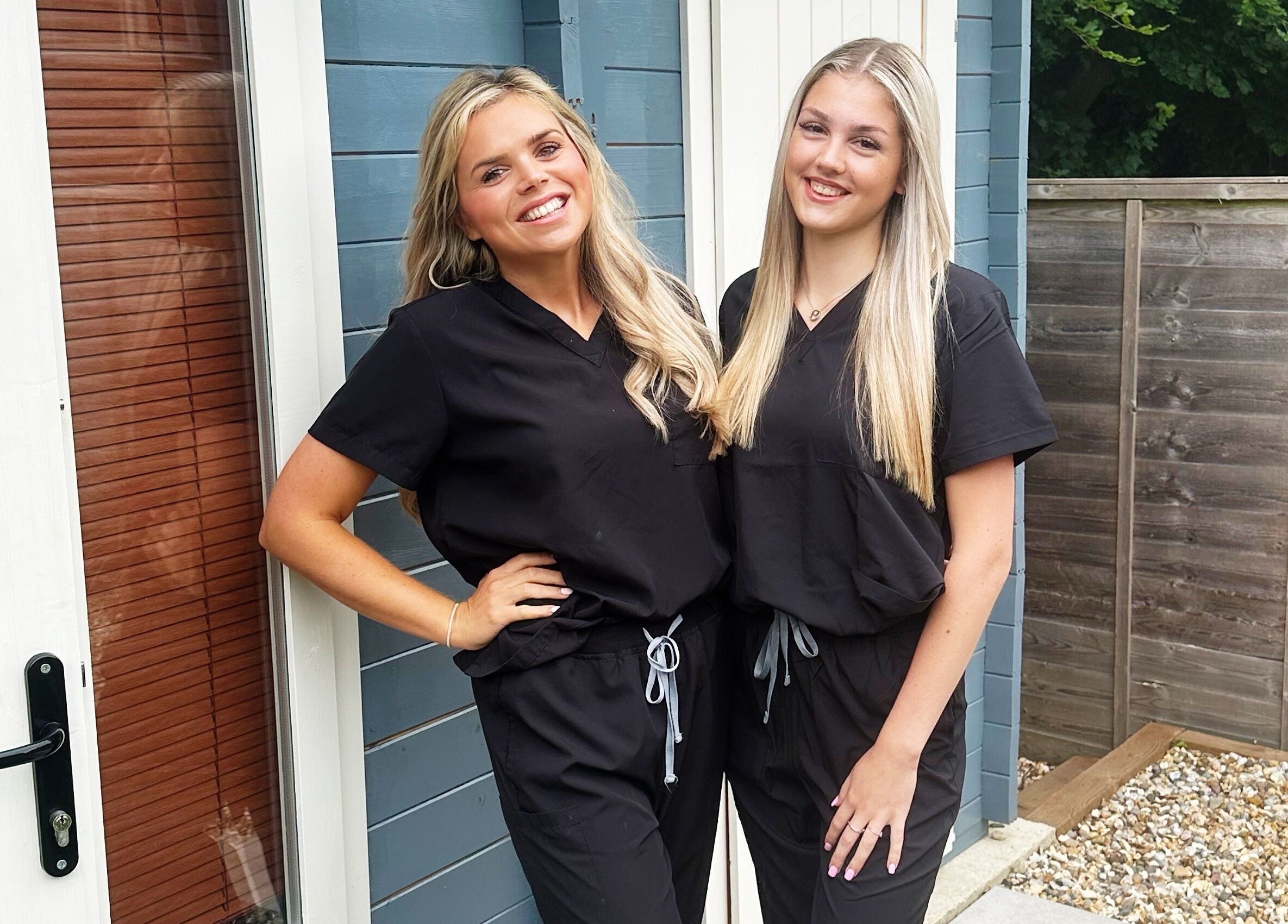 Two smiling professionals at The Skin Chalet, Headley, England, GB, showcasing welcoming service.