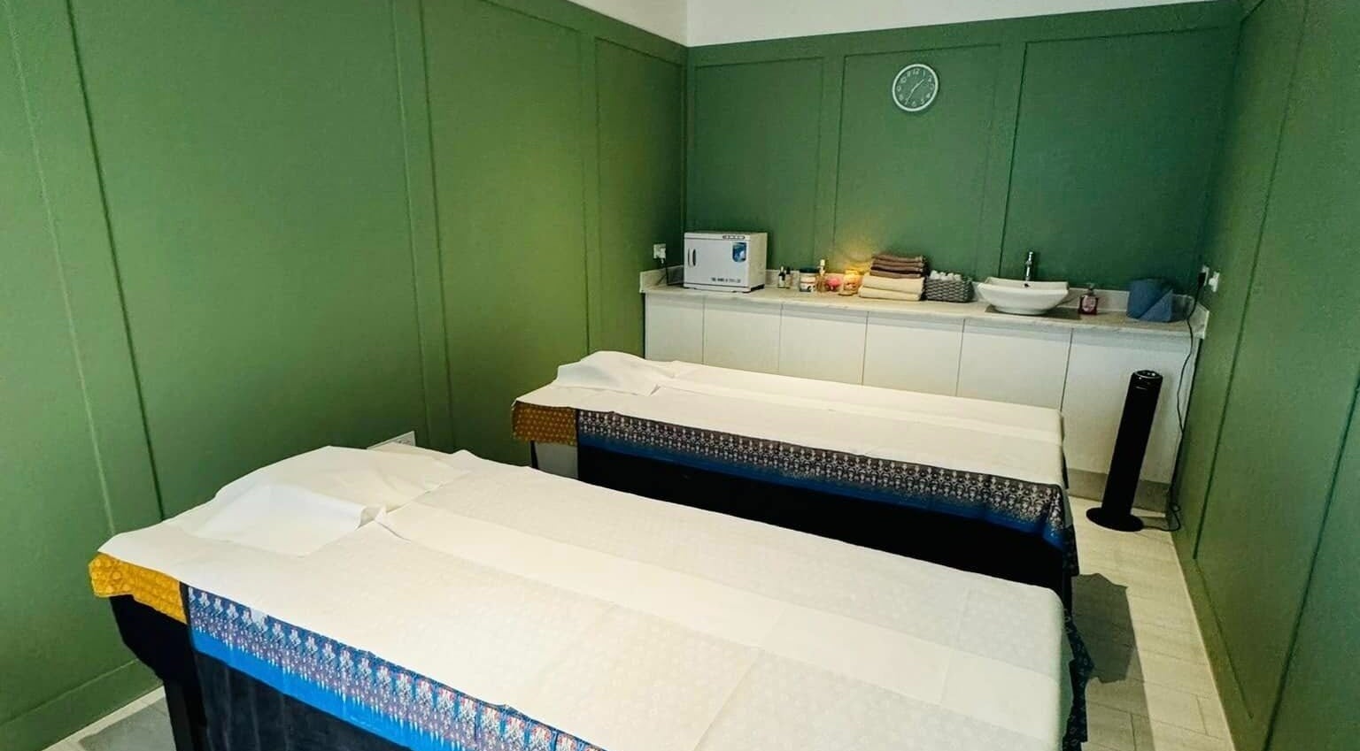 Relaxing massage room at Motion Remedy, Hornchurch, England, GB, featuring two massage tables.