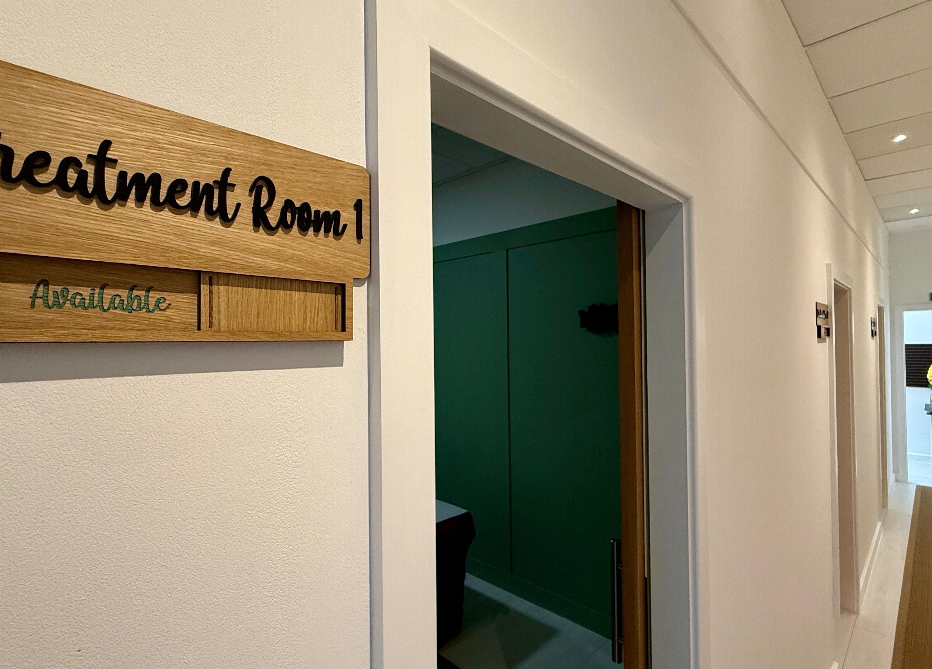 Hallway leading to Treatment Room 1 at Motion Remedy, Hornchurch, England, GB, showcasing a calm ambiance.