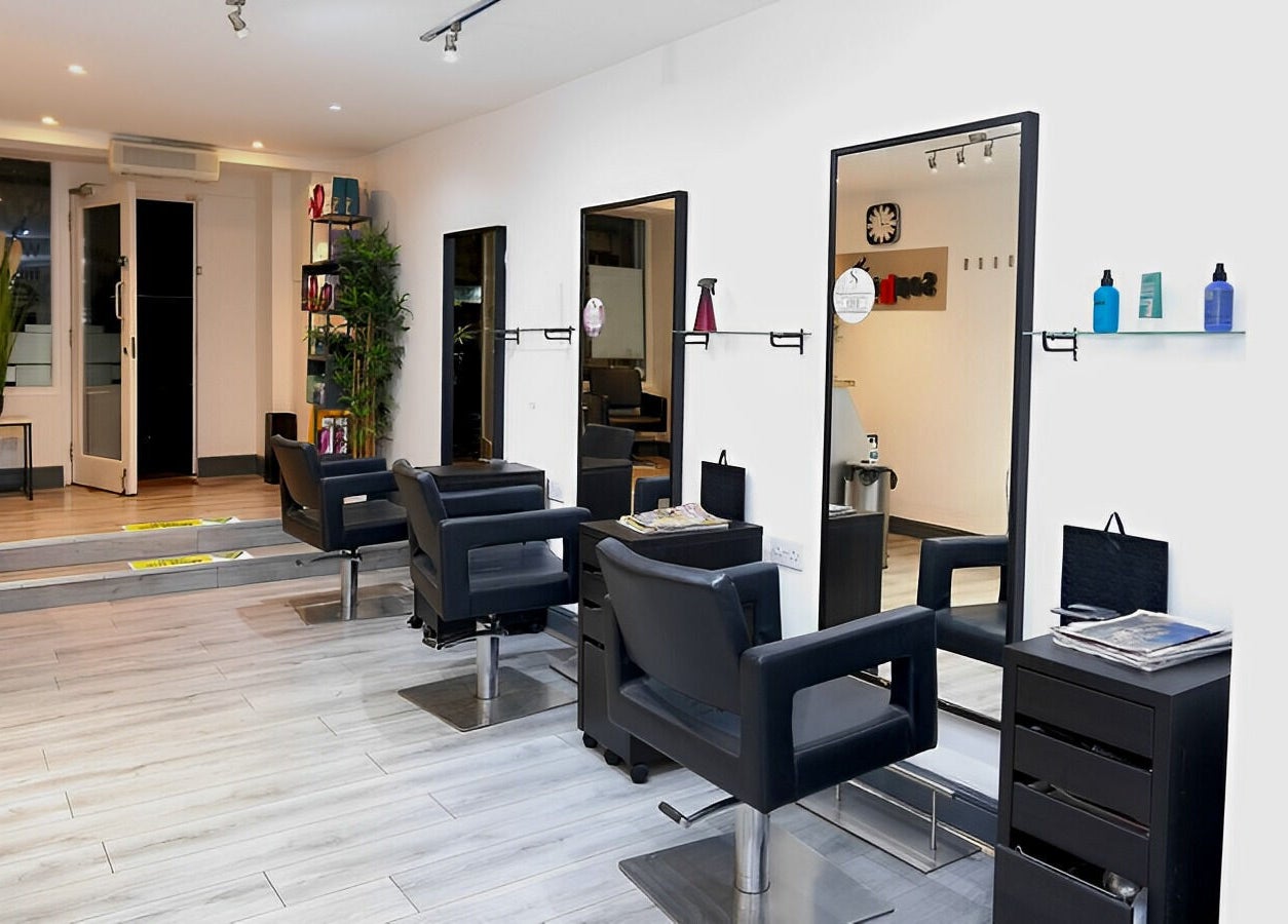 Contemporary interior of Sophie Li Hair Design in Dublin, County Dublin, IE, showcasing stylish salon chairs.