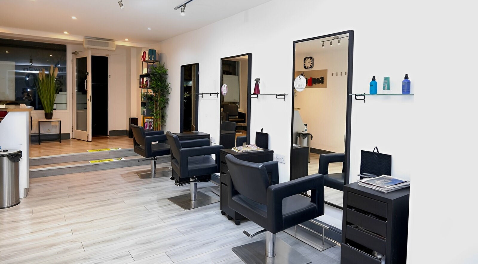 Contemporary interior of Sophie Li Hair Design in Dublin, County Dublin, IE, showcasing stylish salon chairs.