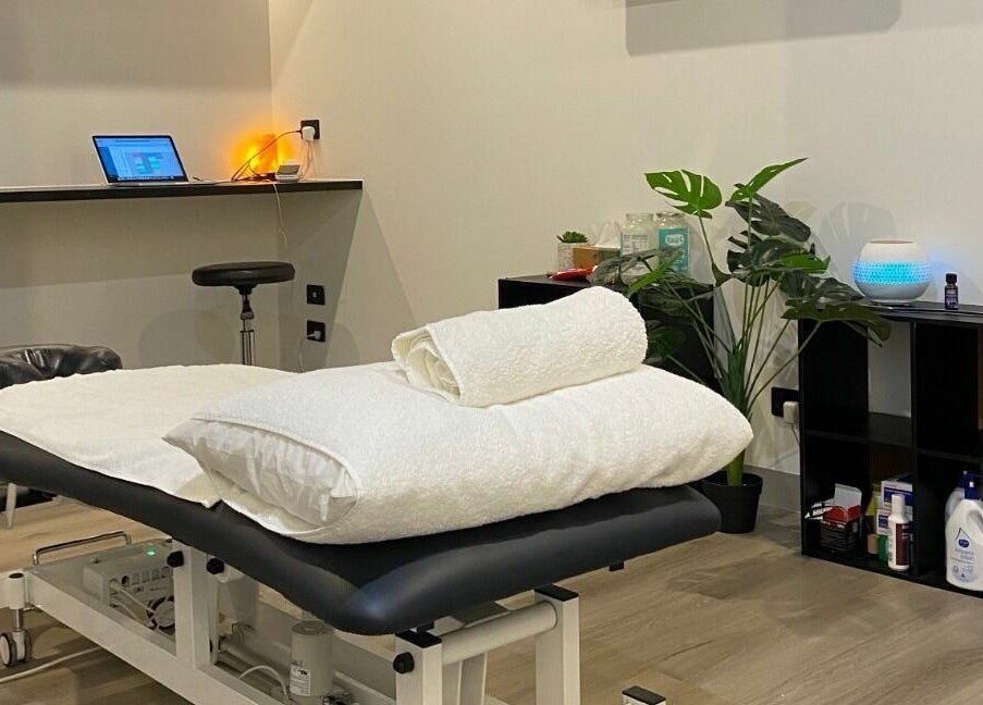 Serene treatment room at Cure HQ Recovery, Niddrie, Victoria, AU with a massage table and ambient lighting.