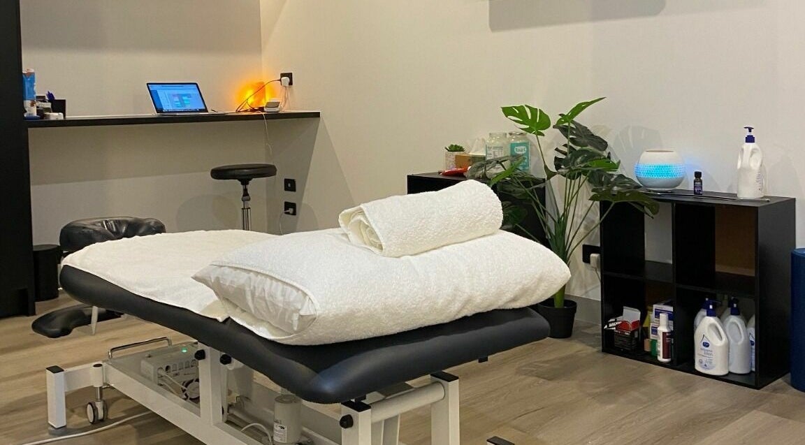 Serene treatment room at Cure HQ Recovery, Niddrie, Victoria, AU with a massage table and ambient lighting.