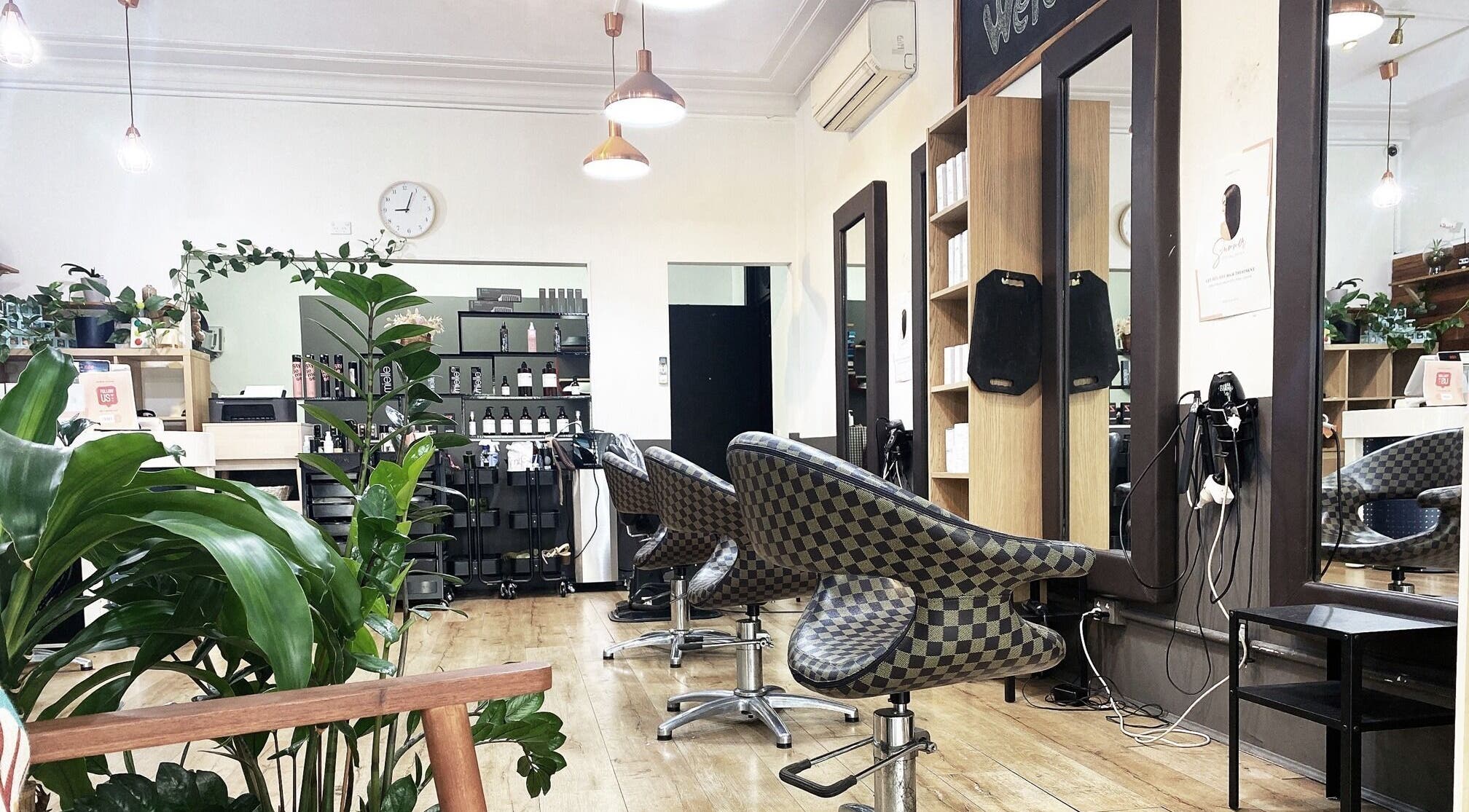 Modern interior of KQueenz Hair salon in Ashfield, New South Wales, AU with stylish chairs and bright lighting.
