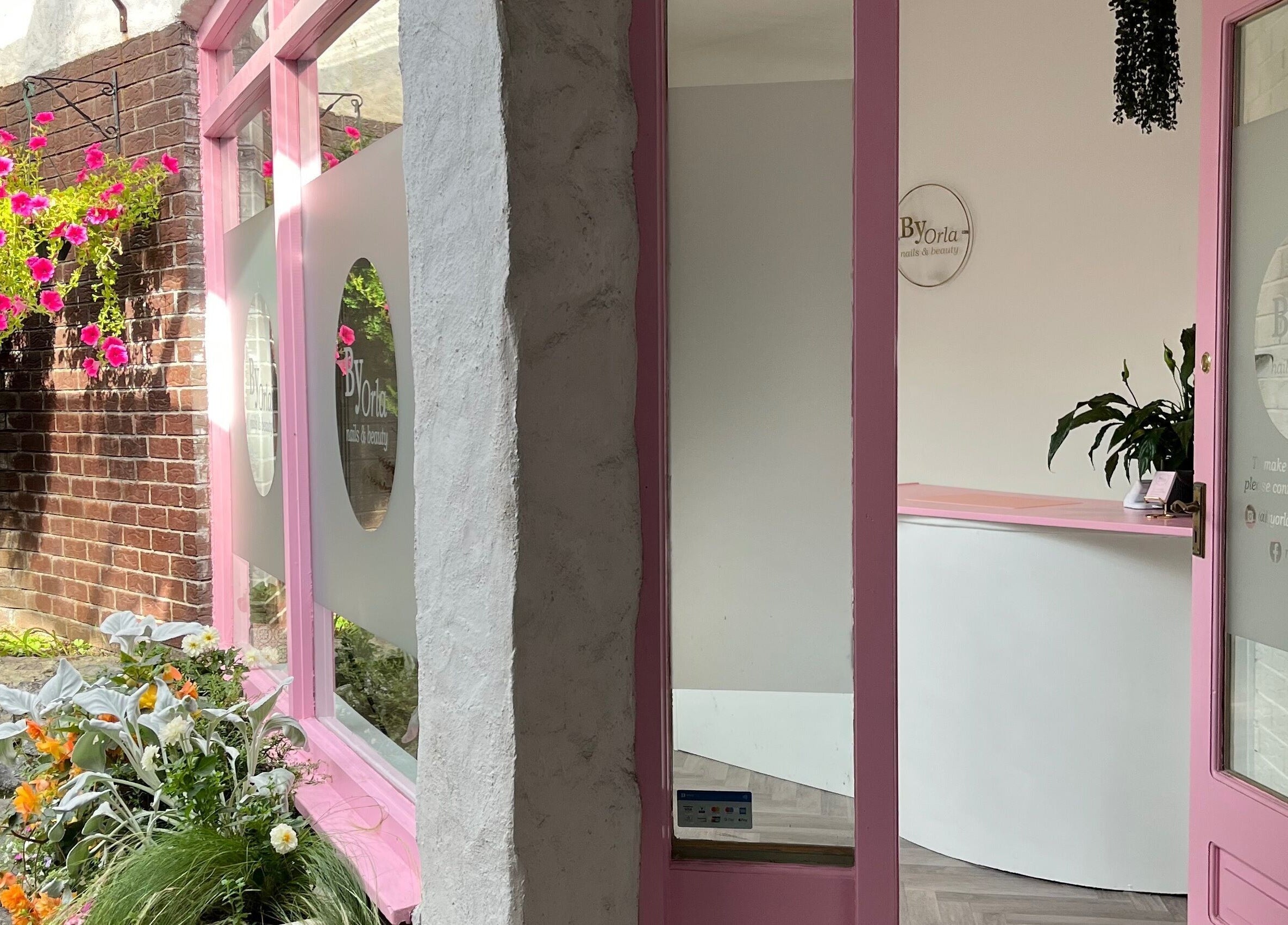 Inviting pink floral entrance of By Orla Nails & Beauty in Boyle, County Roscommon, IE.
