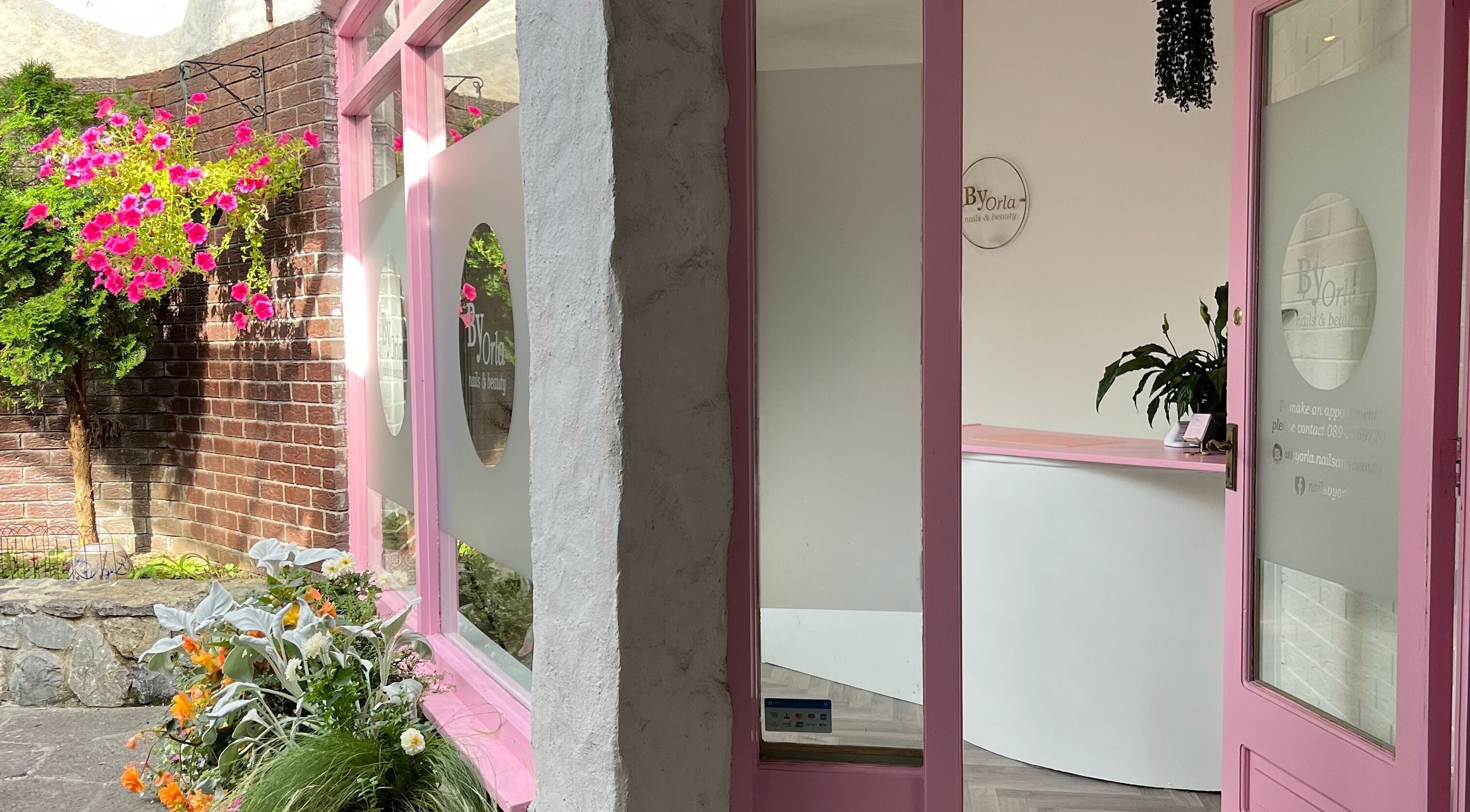 Inviting pink floral entrance of By Orla Nails & Beauty in Boyle, County Roscommon, IE.