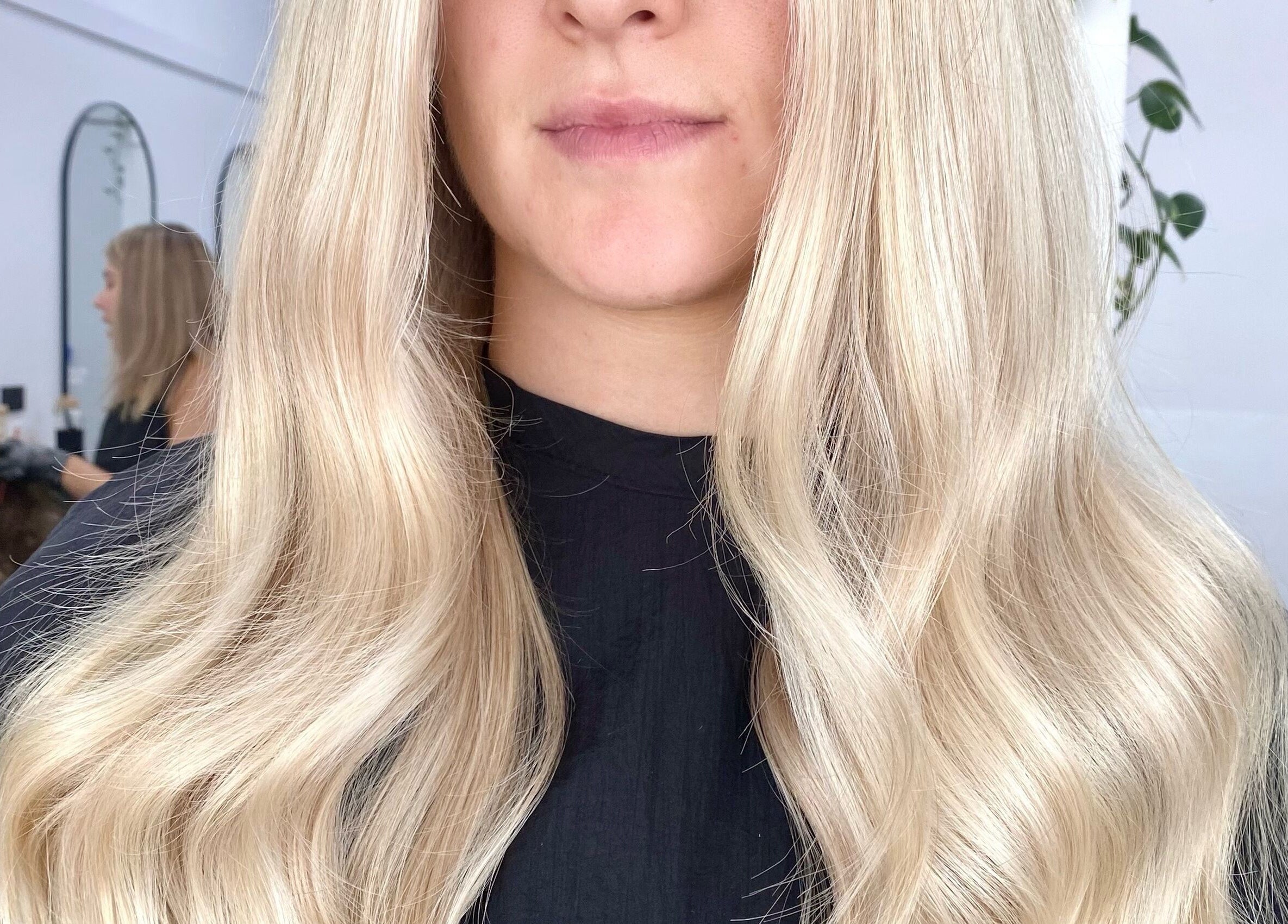 Blonde hair styled at The Hair Sorority, Nerang, Queensland, AU. Elegant waves create a chic look.