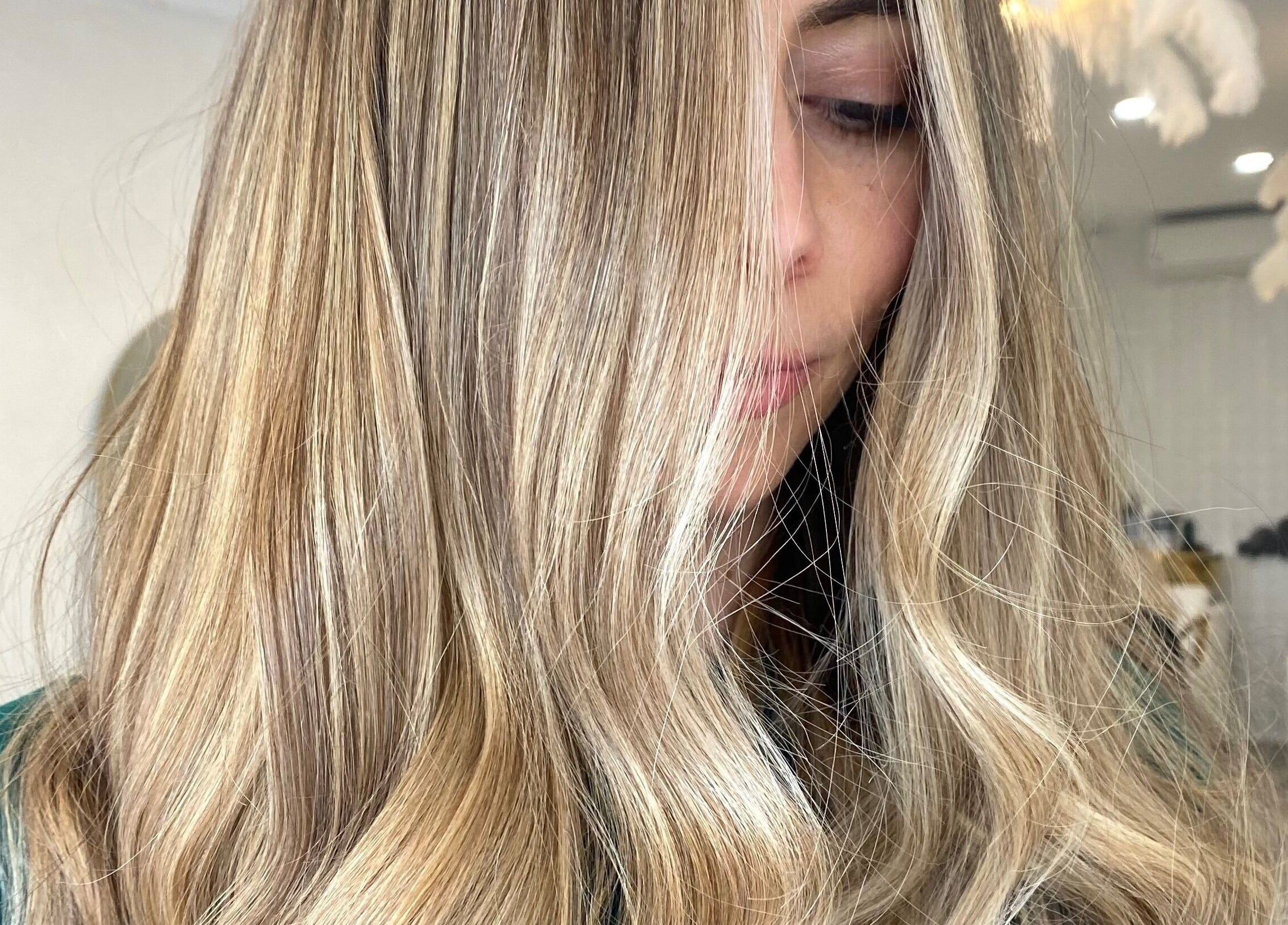 Close-up of styled blonde hair at The Hair Sorority, Nerang, Queensland, AU. Showcasing expert salon services.