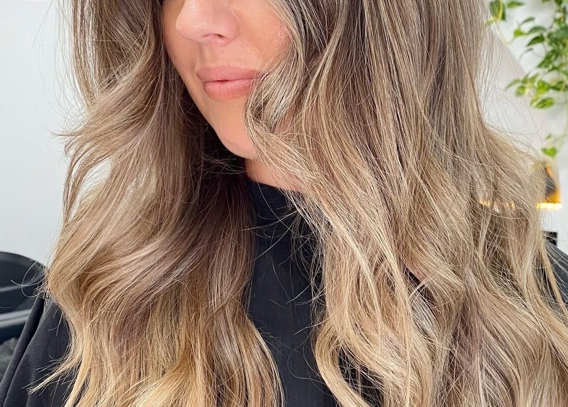 Styled wavy hair at The Hair Sorority, Nerang, Queensland, AU showcasing expert coloring and texture.