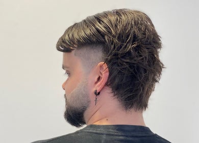 Modern undercut hairstyle at Marcushampton_hair, Glasgow, Scotland, GB. Trendy look with volume and texture.