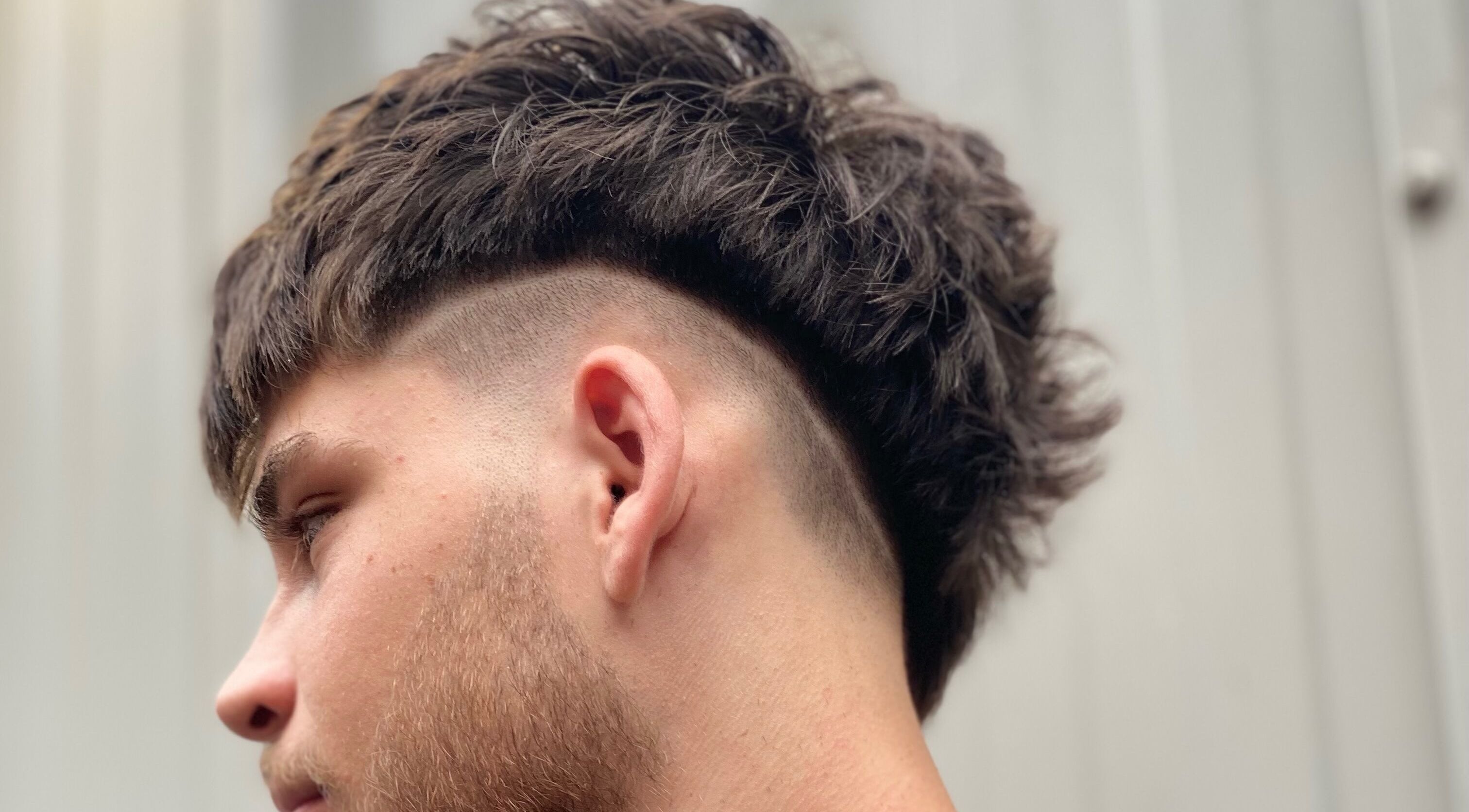 Trendy haircut at Marcushampton Hair, showcasing modern style in Glasgow, Scotland, GB.