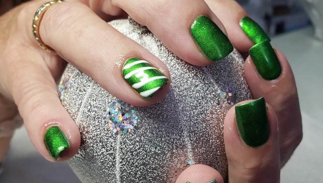 Vibrant green nail art at Bisou Spa, Hastings, Christ Church, BB. Perfect for a stylish look.