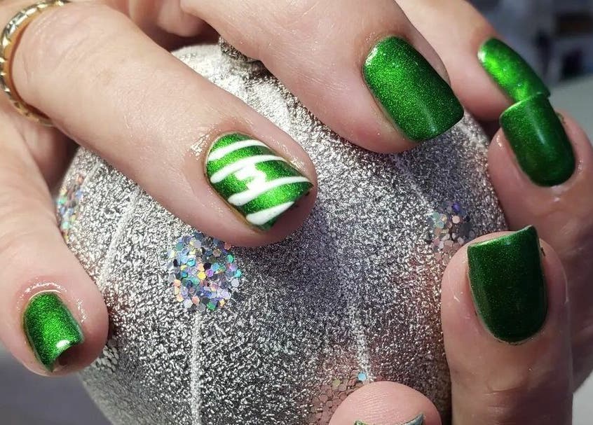 Vibrant green nail art at Bisou Spa, Hastings, Christ Church, BB. Perfect for a stylish look.