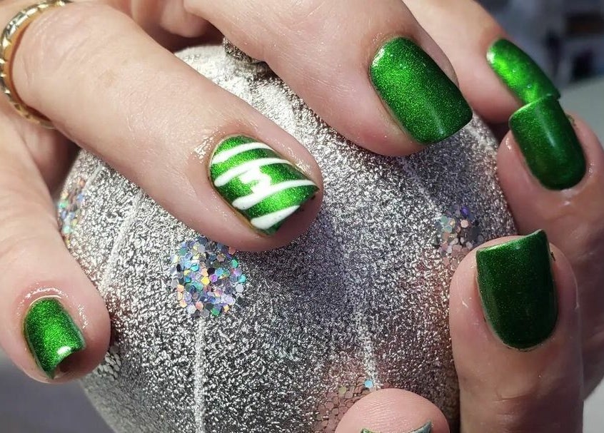Vibrant green nail art at Bisou Spa, Hastings, Christ Church, BB. Perfect for a stylish look.