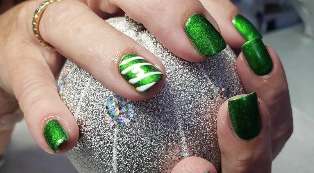 Vibrant green nail art at Bisou Spa, Hastings, Christ Church, BB. Perfect for a stylish look.