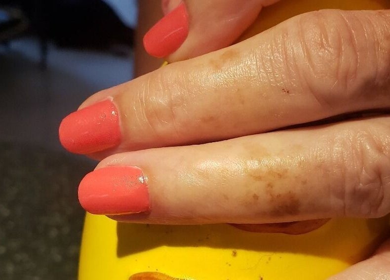 Beautiful coral manicure at Bisou Spa in Hastings, Christ Church, BB. Experience expert nail care.