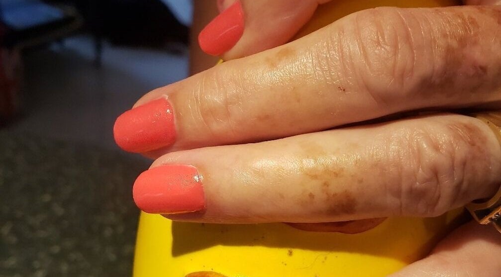 Beautiful coral manicure at Bisou Spa in Hastings, Christ Church, BB. Experience expert nail care.