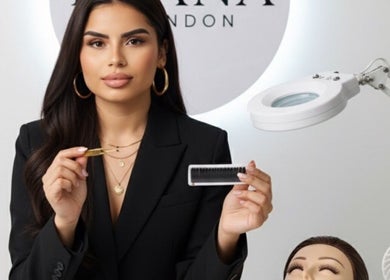 Professional demonstrating eyelash tools at Byana London, Enfield, England, GB, enhances natural beauty with skill.