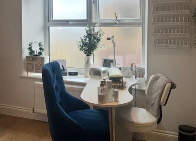 Cozy nail station at Rebecca at The Beauty Rooms, Langho, England, GB with plush chair and beauty products.