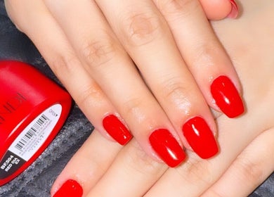 Bright red manicured nails at Lilian Beauty Salon, Juffair, Bahrain, BH showcasing vibrant polish.