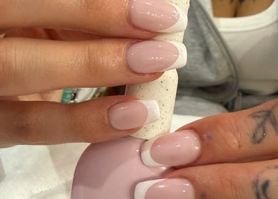 French manicure at Lilian Beauty Salon, Juffair, Bahrain. Perfectly polished nails displayed in a chic setting.