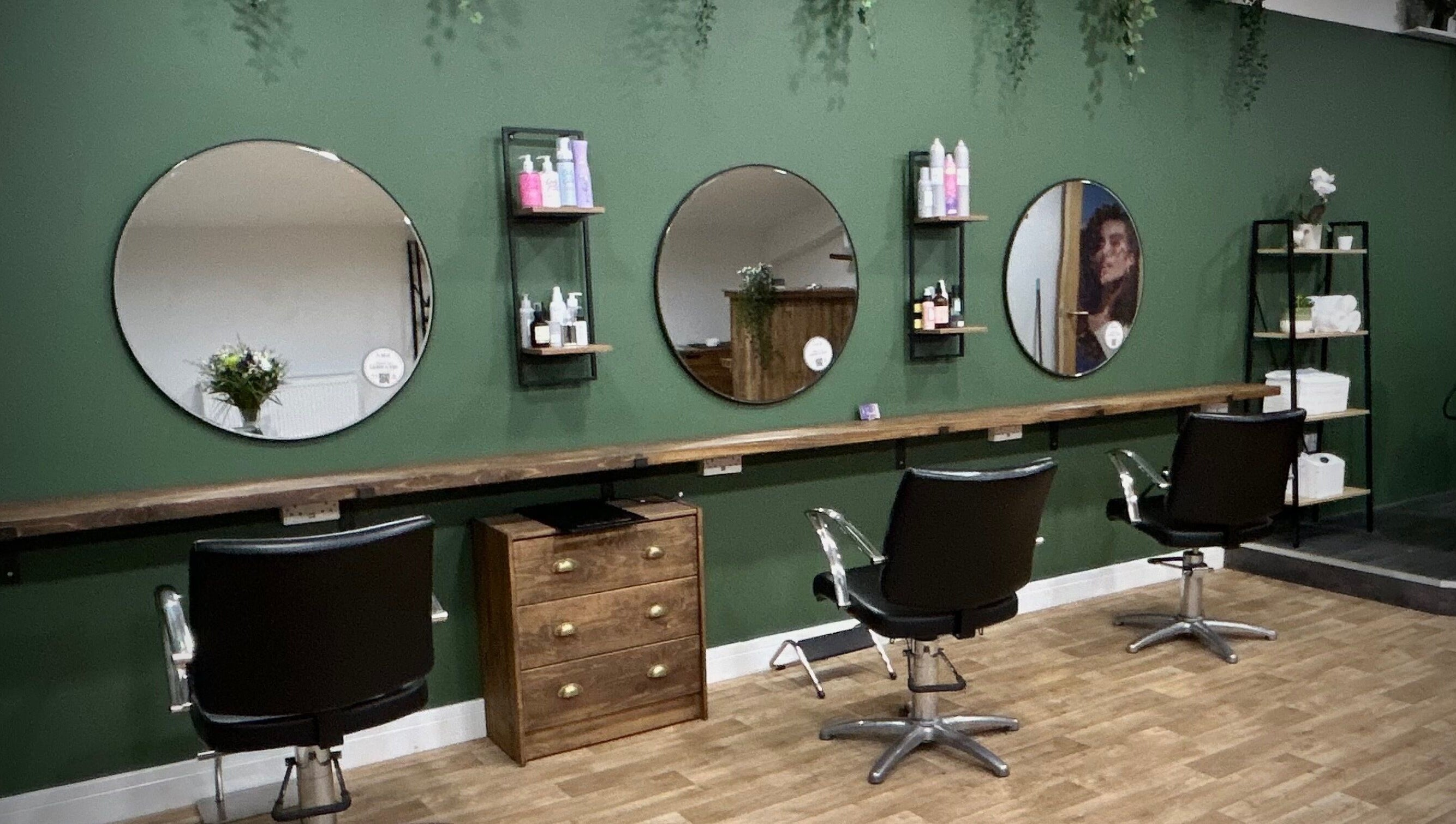 Elegant interior of Hair by Éloise in Lyneham, England, GB highlighting stylish salon chairs and mirrors.