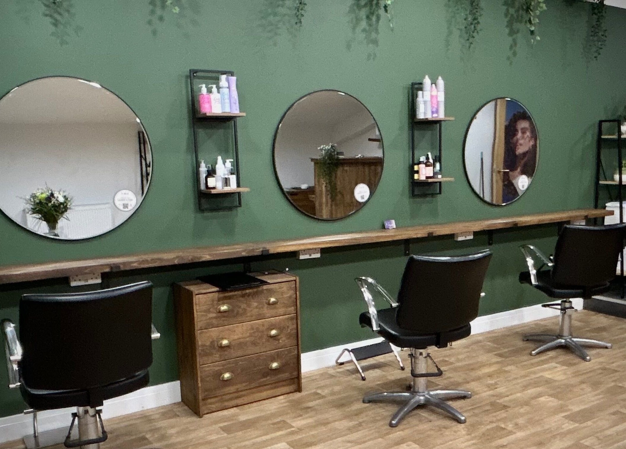 Elegant interior of Hair by Éloise in Lyneham, England, GB highlighting stylish salon chairs and mirrors.
