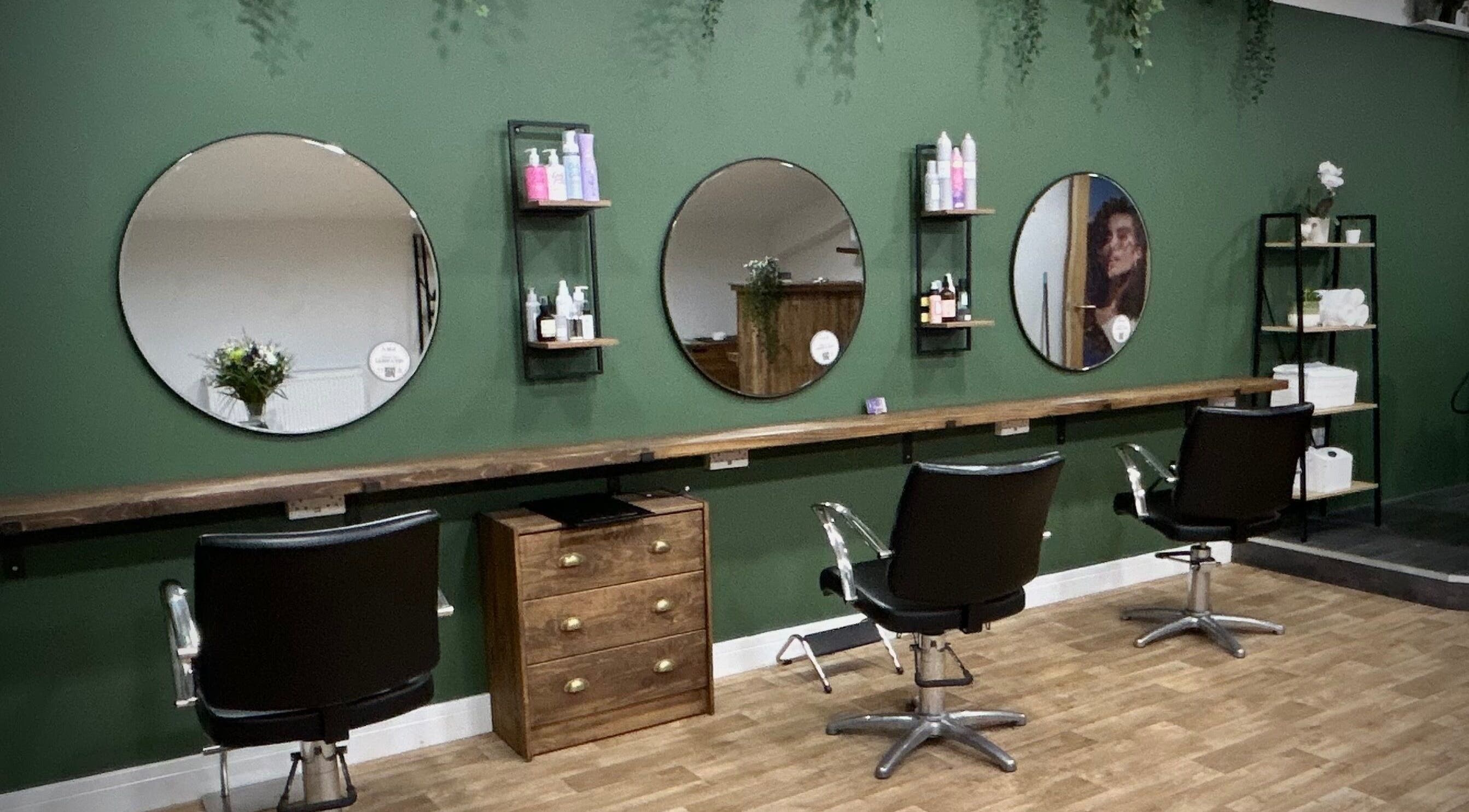 Elegant interior of Hair by Éloise in Lyneham, England, GB highlighting stylish salon chairs and mirrors.