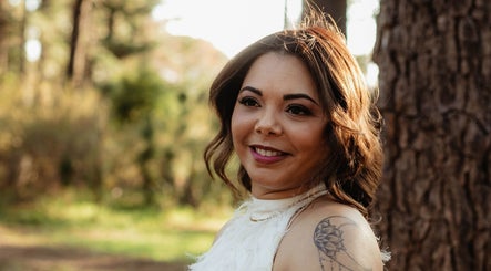 Smiling woman with elegant makeup by Makeup by Ameerah in Cape Town, Western Cape, ZA outdoor setting.