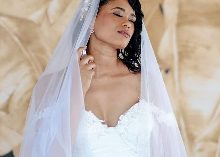 Bride with veil and serene expression at Makeup by Ameerah in Cape Town, Western Cape, ZA.