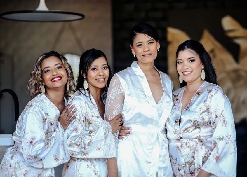Bridesmaids in silk robes at Makeup by Ameerah, Cape Town, Western Cape, ZA, showcasing elegant bridal preparation.