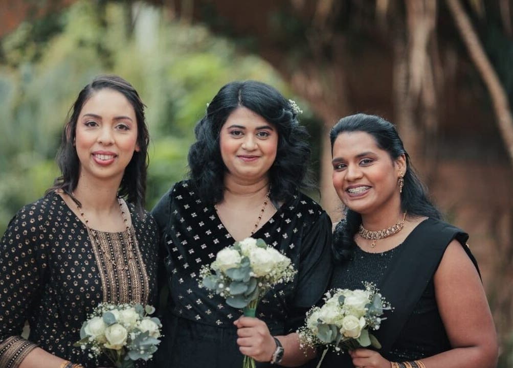 Three women with floral bouquets, styled by Makeup by Ameerah, Cape Town, Western Cape, ZA.