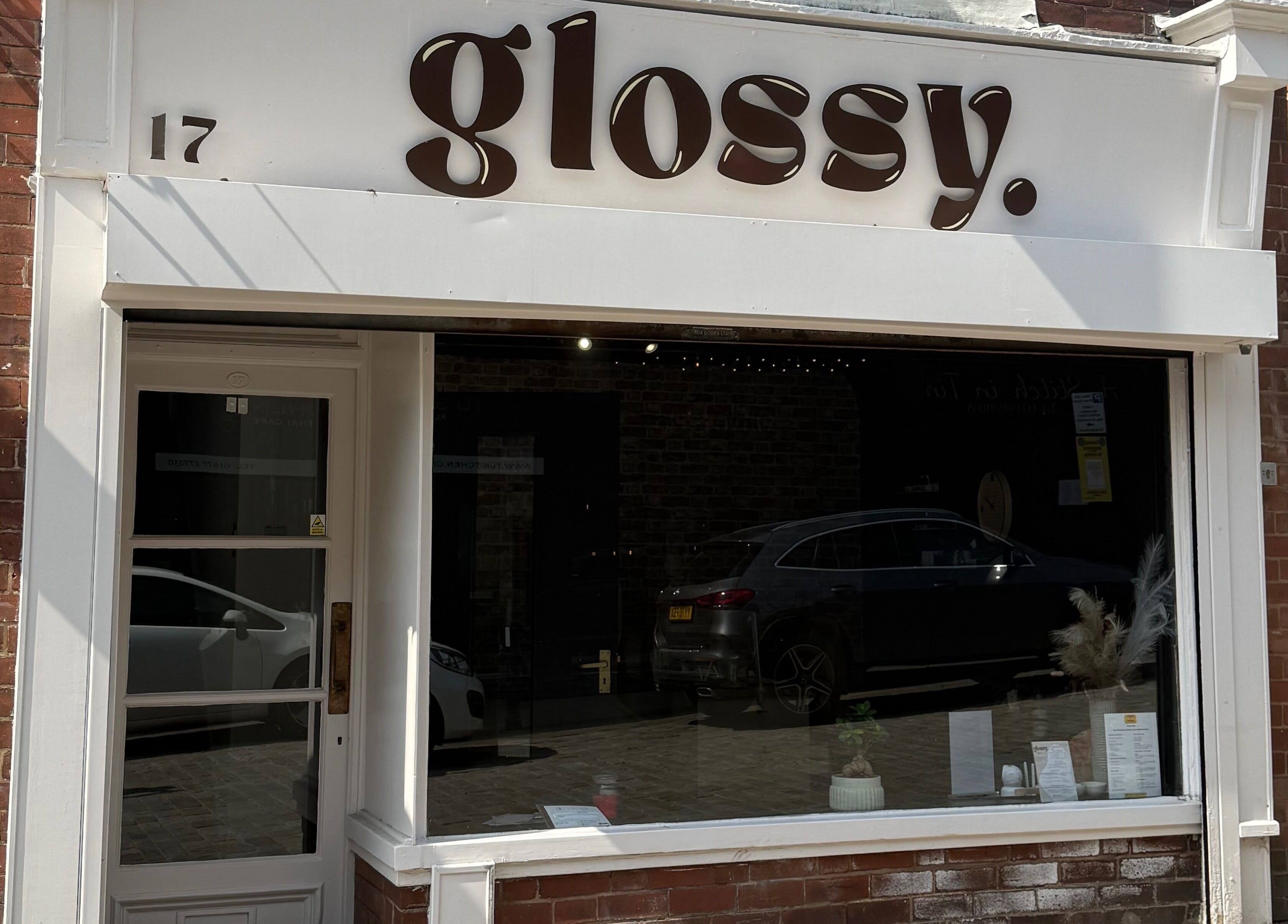 Front view of Glossy salon in Pontefract, England, GB with a stylish modern exterior.