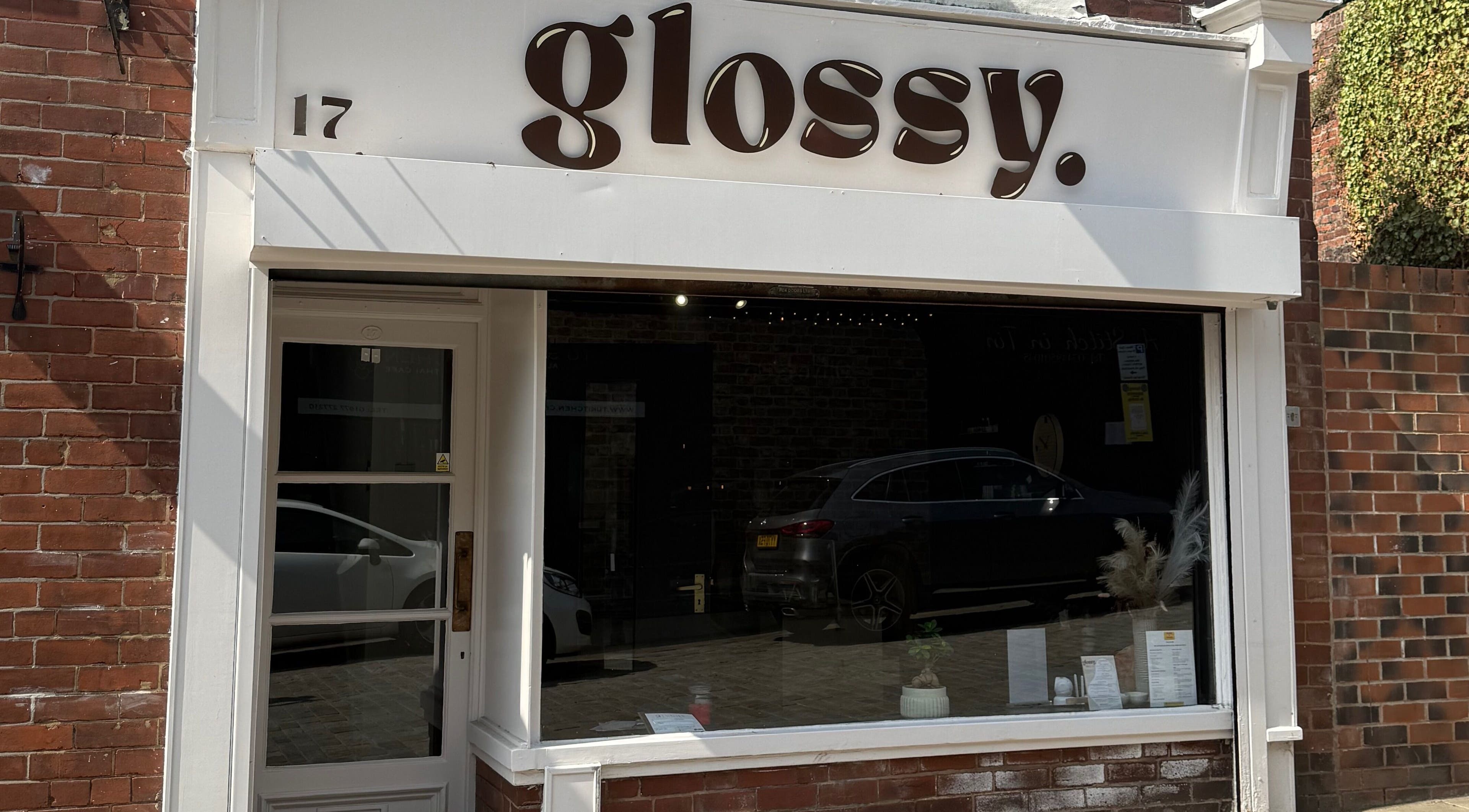 Front view of Glossy salon in Pontefract, England, GB with a stylish modern exterior.