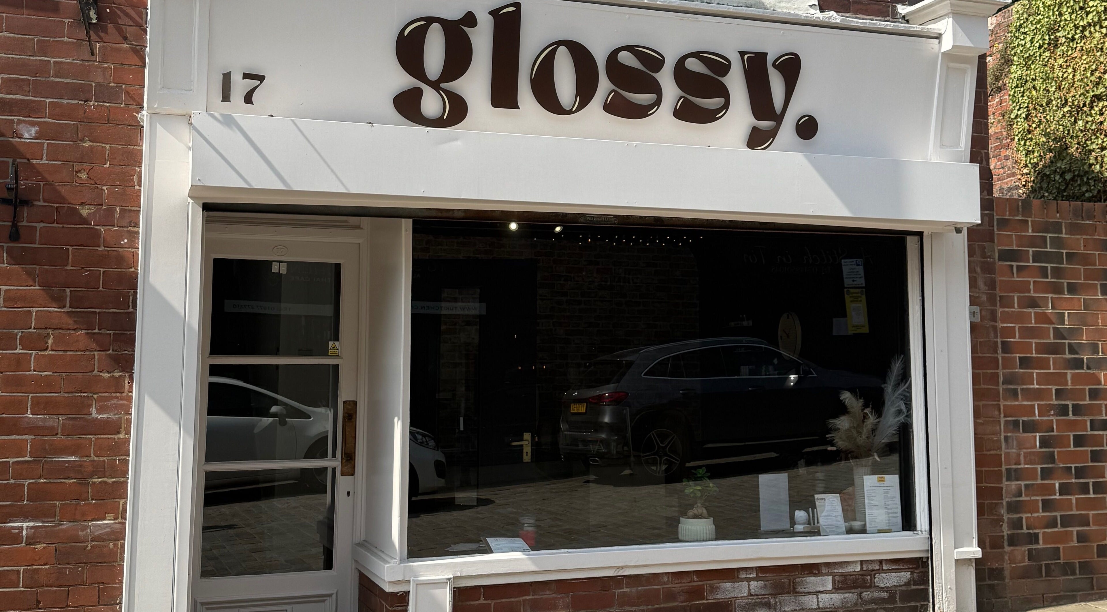 Front view of Glossy salon in Pontefract, England, GB with a stylish modern exterior.