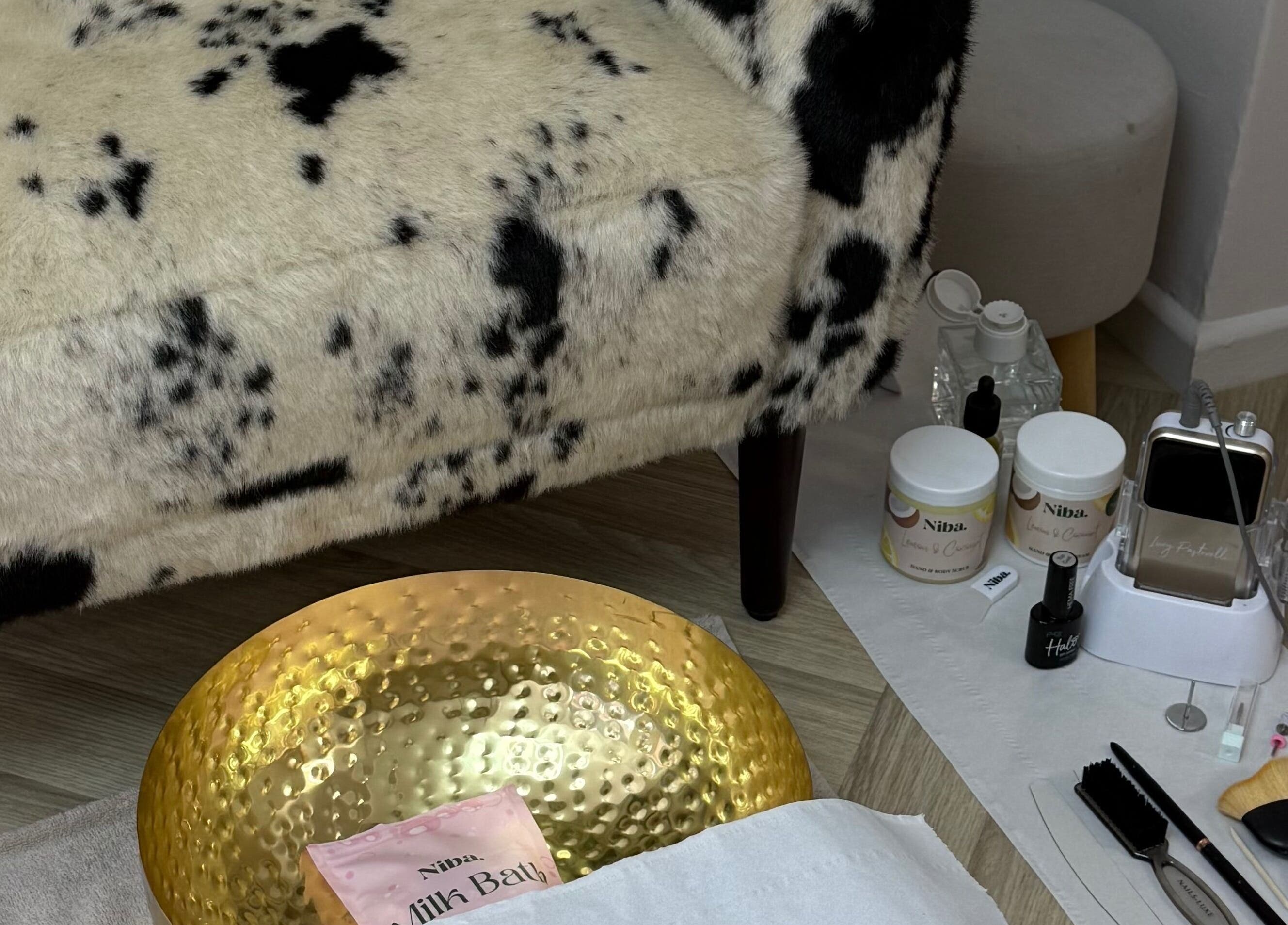 Luxurious spa setup at Glossy in Pontefract, England, GB with plush seating and beauty tools.