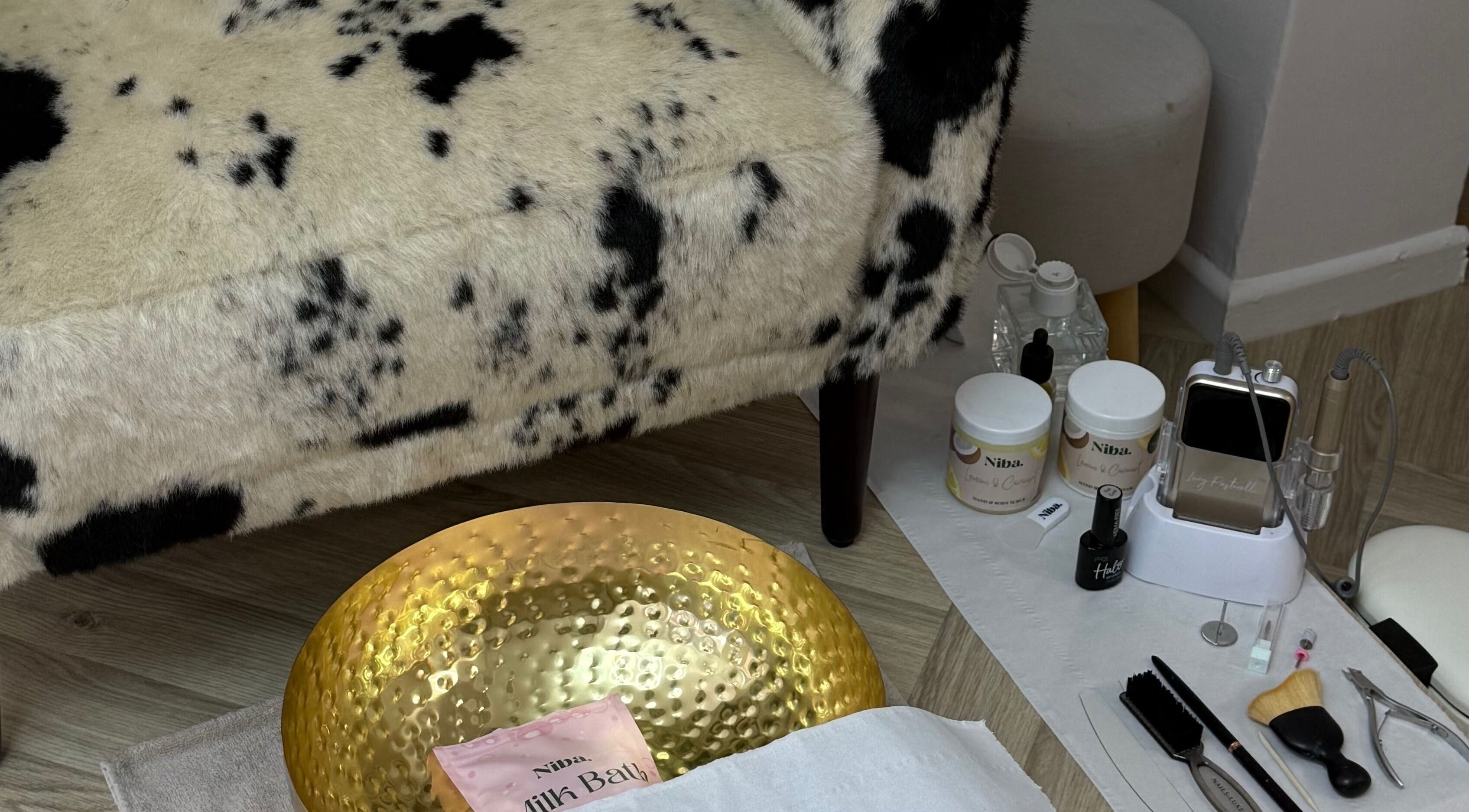 Luxurious spa setup at Glossy in Pontefract, England, GB with plush seating and beauty tools.