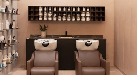 Elegant shampoo stations at Stellar Salon, Riyadh, SA, with luxurious products and modern decor.