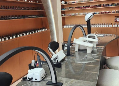 Chic nail bar at Stellar Salon, Riyadh, SA, featuring sleek design and extensive polish selection.