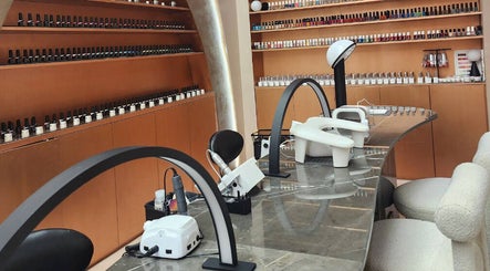 Chic nail bar at Stellar Salon, Riyadh, SA, featuring sleek design and extensive polish selection.