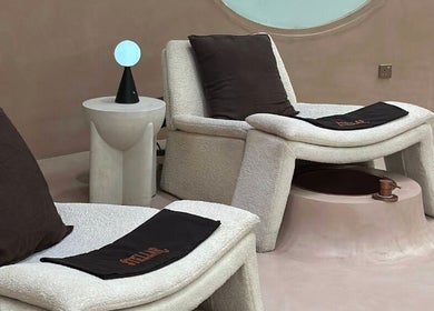 Comfortable lounge chairs at Stellar Salon, Riyadh SA, offer a serene wellness experience.