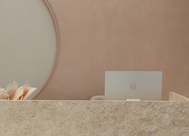 Elegant reception desk at Stellar Salon, Riyadh, SA, featuring a sleek design and minimalist decor.