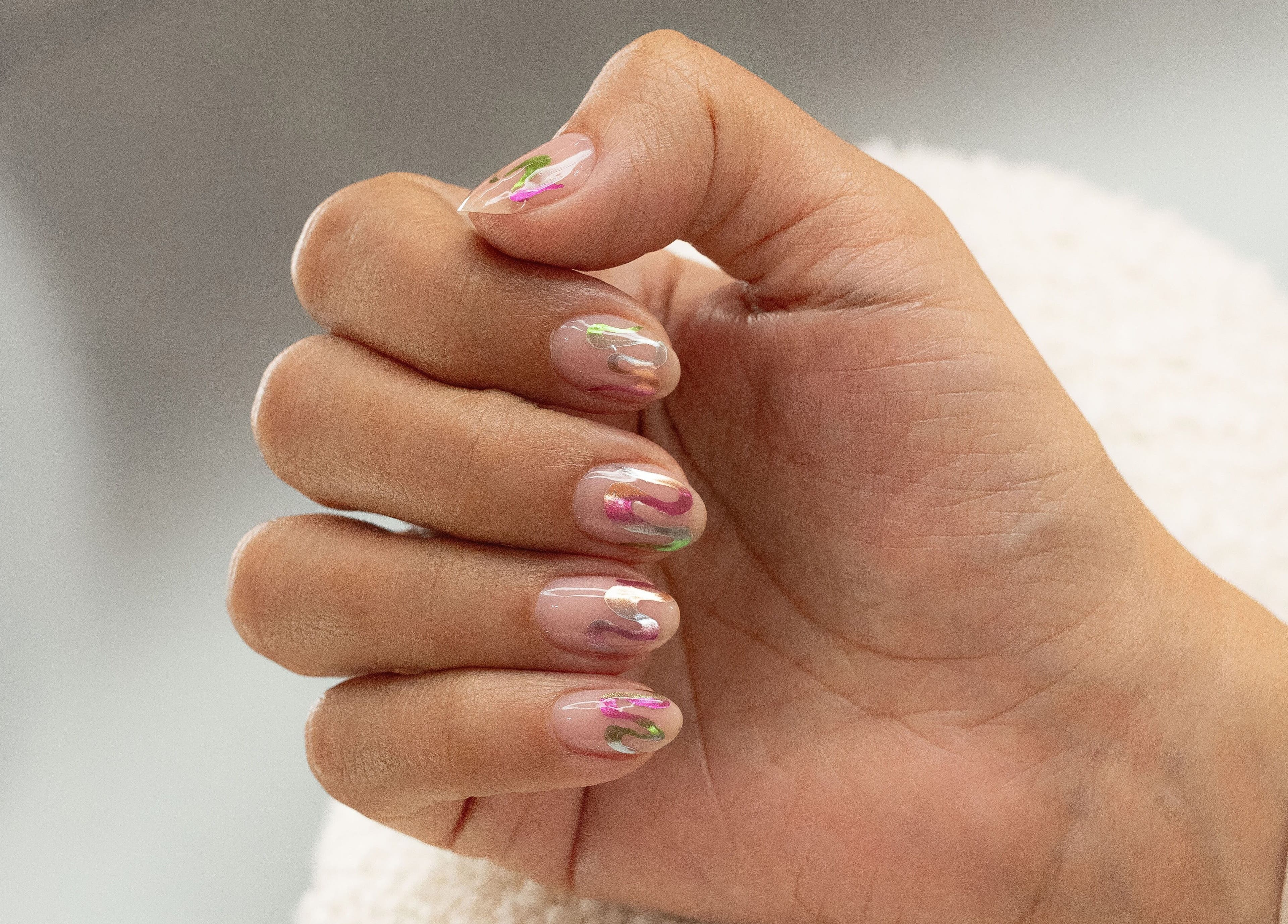 Stylish nail art at Stellar Salon in Riyadh, Riyadh Province, SA featuring colorful design on manicured nails.