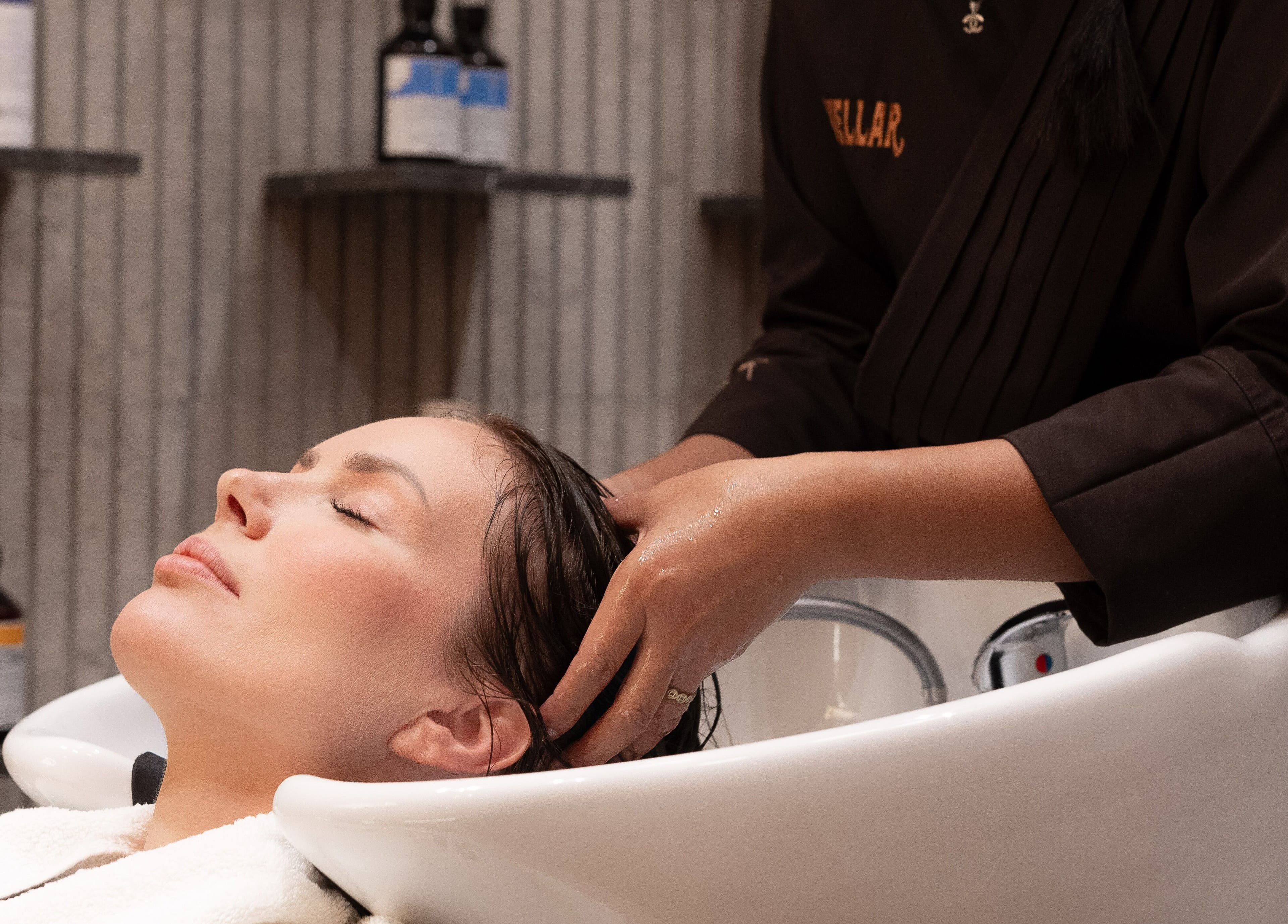 Client enjoys a soothing hair wash at Stellar Salon in Riyadh, Riyadh Province, SA.