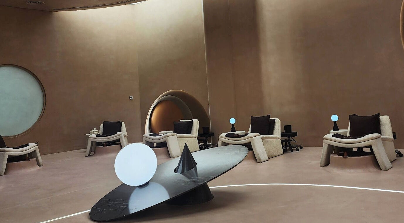 Elegant relaxation area at Stellar Salon in Riyadh, Riyadh Province, SA, featuring modern chairs and ambient lighting.