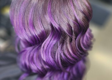 Purple wavy hairstyle at Alexandra Hair in Hucknall, England, GB. Captivating and stylish design.