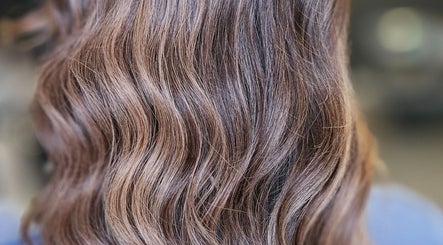 Rich, wavy brunette hair styled at Alexandra Hair in Hucknall, England, GB. Perfect shine and texture.