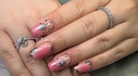 Pink starry nail art set at Glamorous Nails & Lashes, Peterborough, England, GB.
