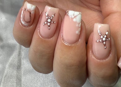 Elegant nail art with star embellishments at Glamorous Nails & Lashes, Peterborough, England, GB.
